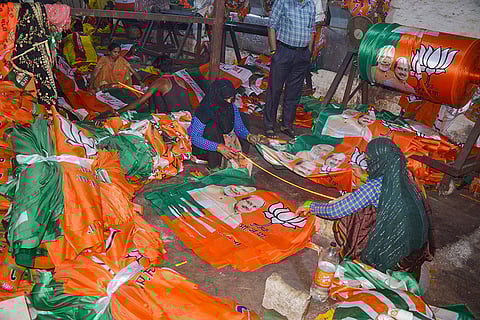 Workers prepare election material in Mathura