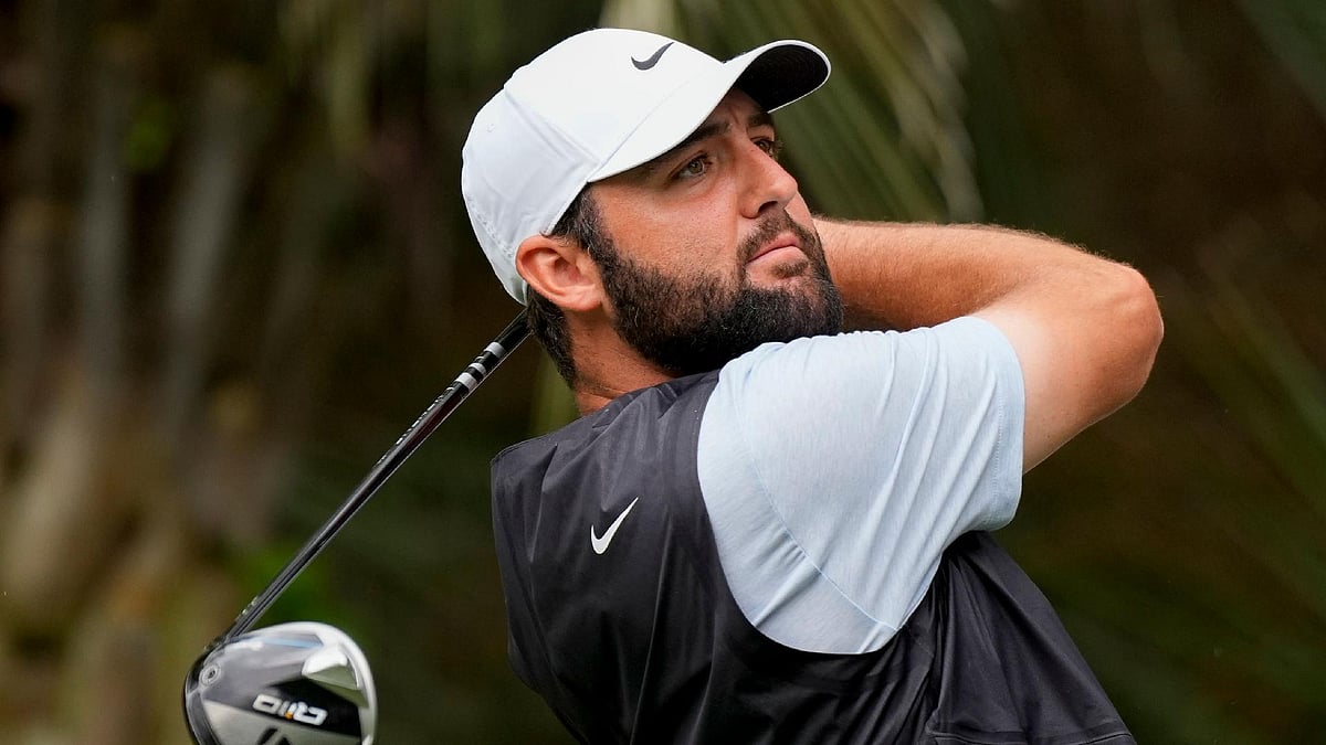 Chris Carlson/AP : Scottie Scheffler watches his tee shot at the RBC Heritage golf tournament.