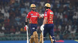 AP Photo/Pankaj Nangia : Punjab Kings' captain Shikhar Dhawan, left fist bumps with batting partner Jonny Bairstow during the Indian Premier League 2024 match between Lucknow Super Giants and Punjab Kings in Lucknow.