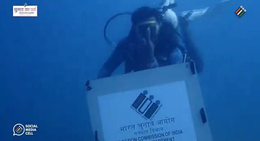TN elections CEO  : Scuba divers swim deep into the Arabian Sea to display a placard
