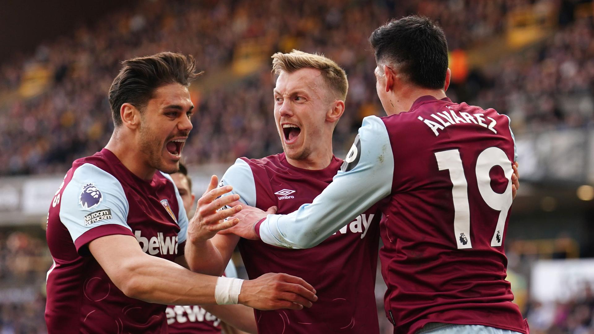 West Ham United’s James Ward-Prowse (centre) celebrates with Konstantinos Mavropanos (left) and Edson Alvarez after scoring their second goal of the game during the Premier League match at Molineux, Wolverhampton. - null