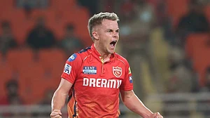 AP Photo/Surjeet Yadav : Punjab Kings' Sam Curran celebrates the dismissal of Sunrisers Hyderabad's Abhishek Sharma during the Indian Premier League cricket match between Sunrisers Hyderabad and Punjab Kings in Mohali.