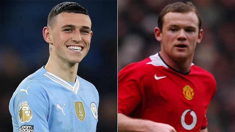 Phil Foden and Wayne Rooney - PA