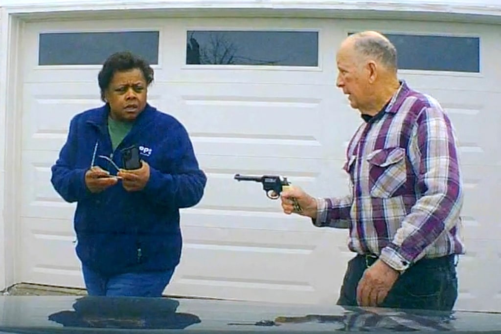 In this image taken from Uber dashcam video released by the Clark County, Ohio, Sheriff's Office, William Brock, right, holds a weapon to Uber driver Loletha Hall outside his home in South Charleston, Ohio, on March 25, 2024. Brock, 81, who authorities say fatally shot Hall who he thought was trying to rob him after scam phone calls deceived them both, was indicted on a murder charge, Monday, April 15, 2024, by a Clark County grand jury. Hall had no knowledge of the calls made to Brock, authorities said.  - AP