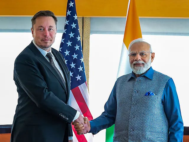 PTI/ File : Tesla CEO Elon Musk with PM Narendra Modi |