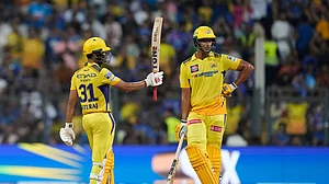 AP Photo/ Rafiq Maqbool : Chennai Super Kings' captain Ruturaj Gaikwad, left, celebrates his fifty runs during the Indian Premier League cricket match between Mumbai Indians and Chennai Super Kings' in Mumbai.