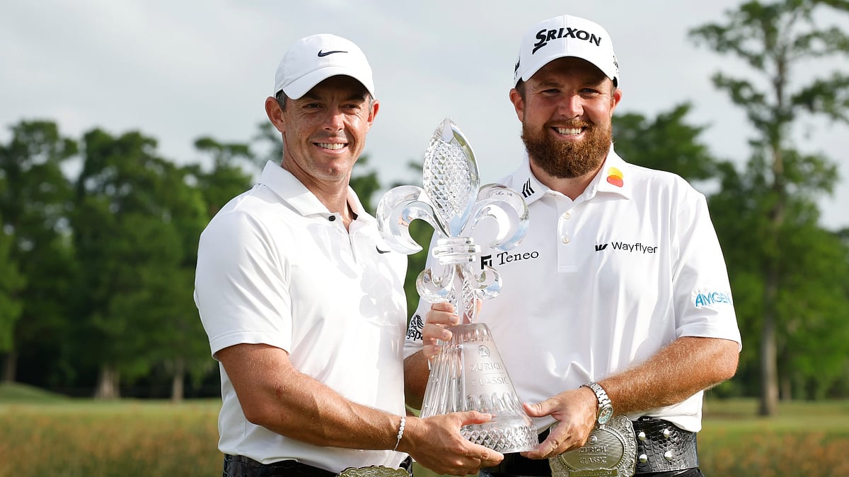 Rory McIlroy and Shane Lowry pose with the trophy after winning the Zurich Classic of New Orleans.