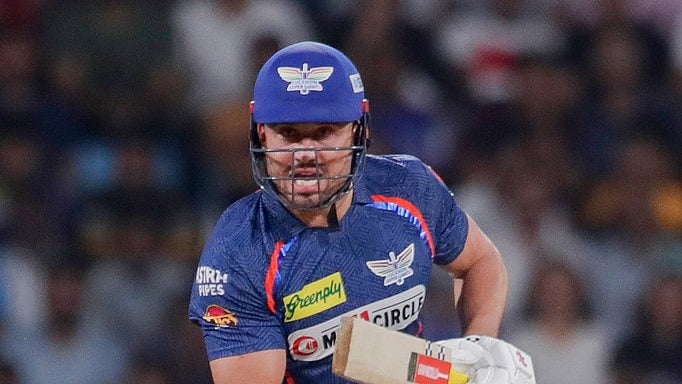 Photo: AP : Marcus Stoinis during LSG's batting against MI.