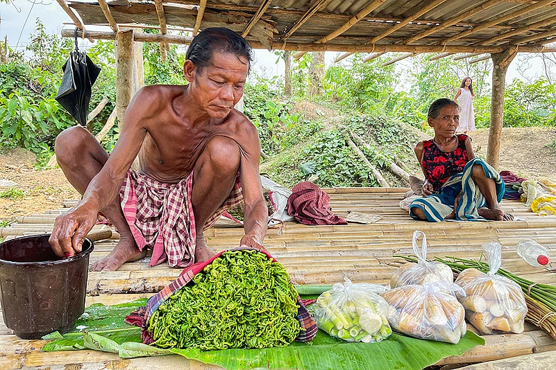 Tribal man sells vegetables in Khowai