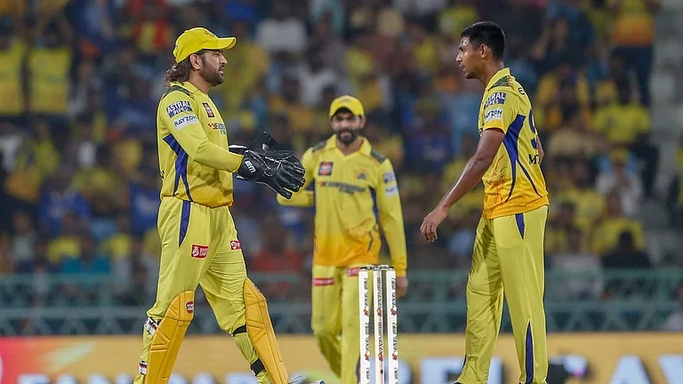 Chennai Super Kings' MS Dhoni, left, and Mustafizur Rahman celebrate the dismissal of Lucknow Super Giants' Quinton de Kock during their Indian Premier League 2024 match in Lucknow on April 19. - AP