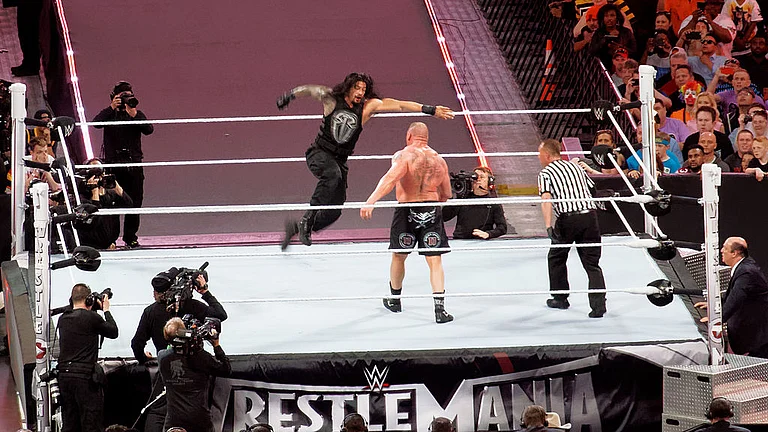 Roman Reigns and Brock Lesner at WrestleMania 31 - Wikimedia Commons/Miguel Discart