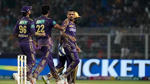 AP Photo/Bikas Das : Kolkata Knight Riders' Sunil Narine, celebrates the wicket of Royal Challengers Bengaluru's Cameron Green with teammates during the Indian Premier League match between Kolkata Knight Riders and Royal Challengers Bengaluru in Kolkata.