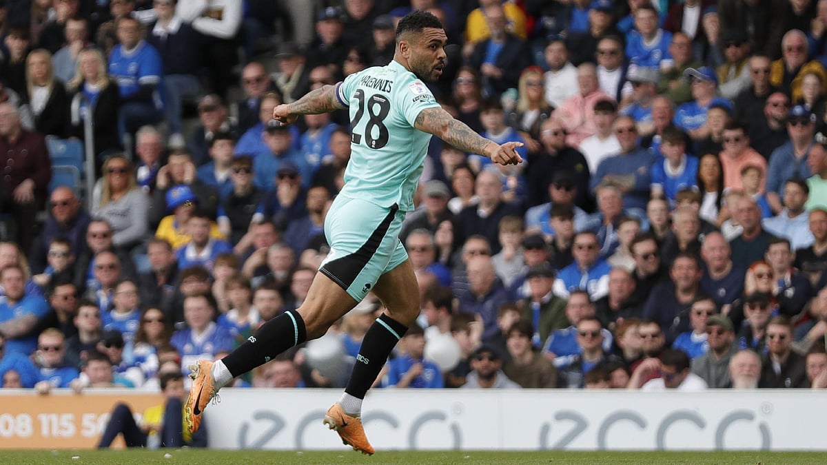 Ben Whitley/PA : Josh Magennis celebrates scoring Wigan’s second goal.