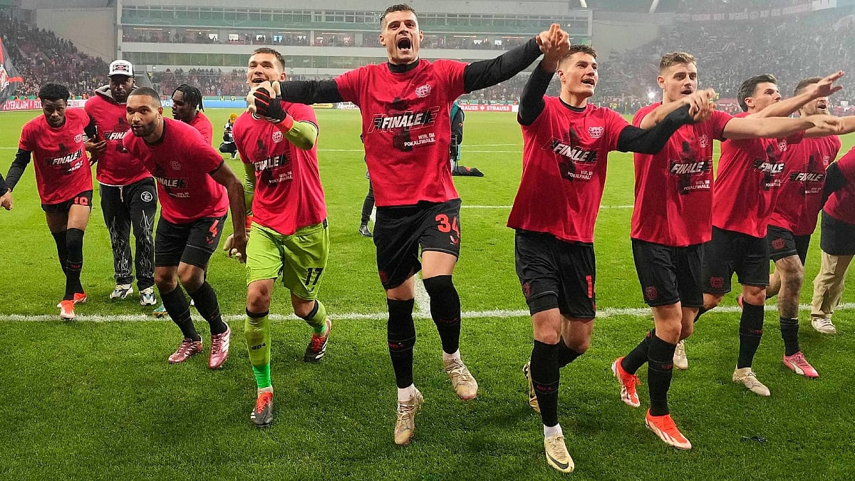 Photo:Martin Meissner/AP : Bayer Leverkusen’s Granit Xhaka celebrates with team mates after reaching the DFB-Pokal final by beating Fortuna Dusseldorf 4-0.