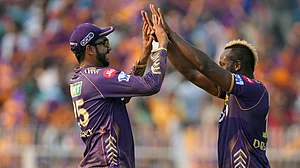 AP Photo/Bikas Das : Kolkata Knight Riders' Andre Russell, right, and teammate Varun Chakaravarthy celebrate the wicket of Lucknow Super Giants' captain KL Rahul during the Indian Premier League cricket match between Kolkata Knight Riders and Lucknow Super Giants in Kolkata.