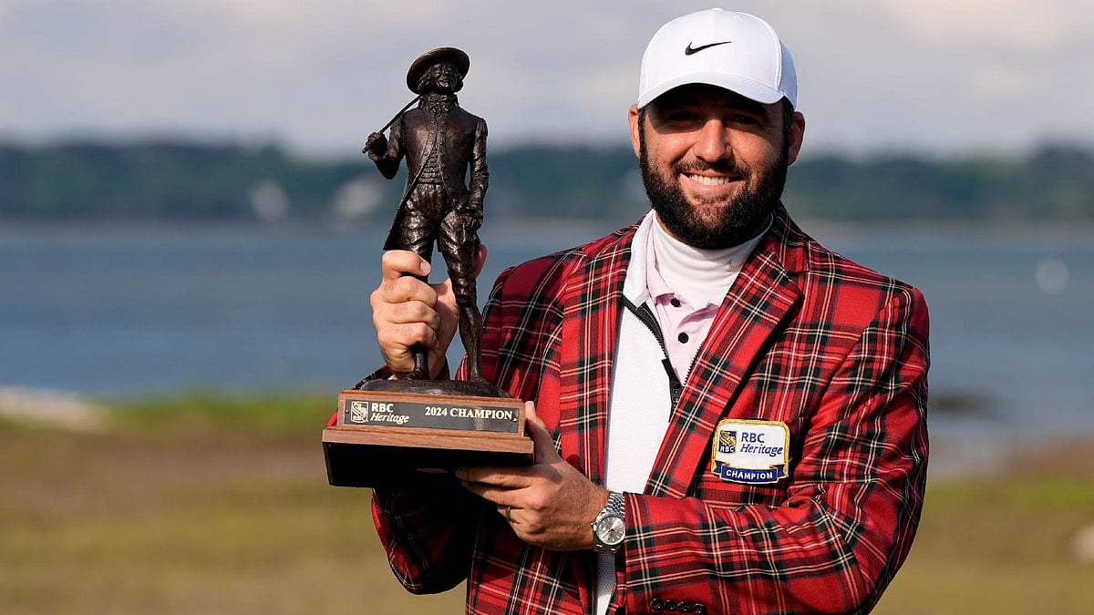 Scottie Scheffler holds the trophy after winning the RBC Heritage for his fourth win in five starts. - Chris Carlson/AP