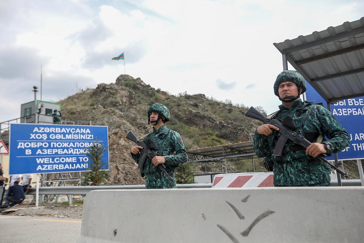 AP : Azerbaijani servicemen guard the Lachin checkpoint on the in Azerbaijan, Sunday, Oct. 1, 2023.