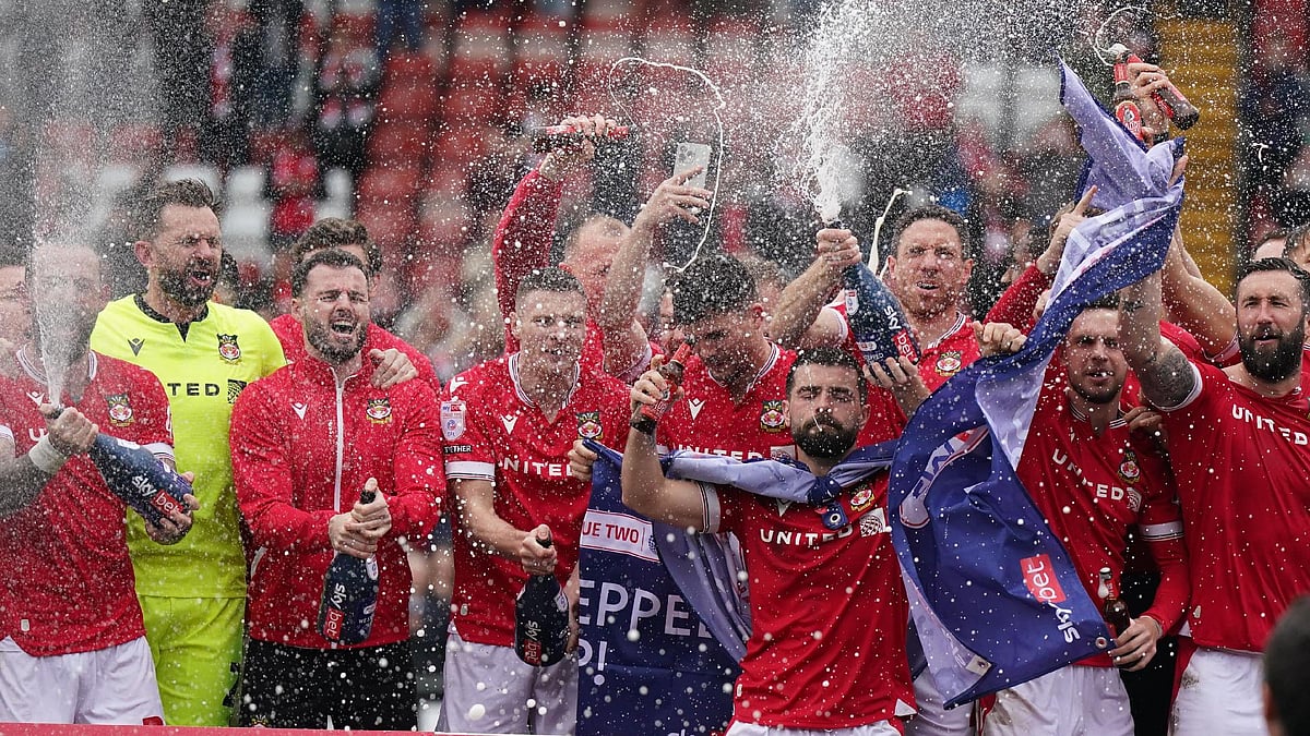 Jacob King/PA : Wrexham players celebrate their promotion.