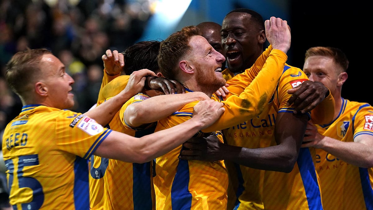 Mansfield’s Stephen Quinn, centre, celebrates scoring against Accrington (Joe Giddens/PA)