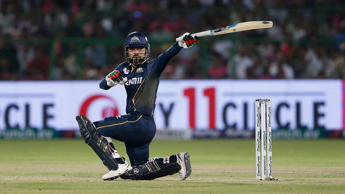 AP Photo/Surjeet Yadav : Gujarat Titans' Rashid Khan bats during the Indian Premier League cricket match between Gujarat Titans and Rajasthan Royals in Jaipur.