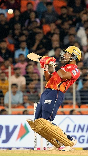 AP : Shashank Singh in action.