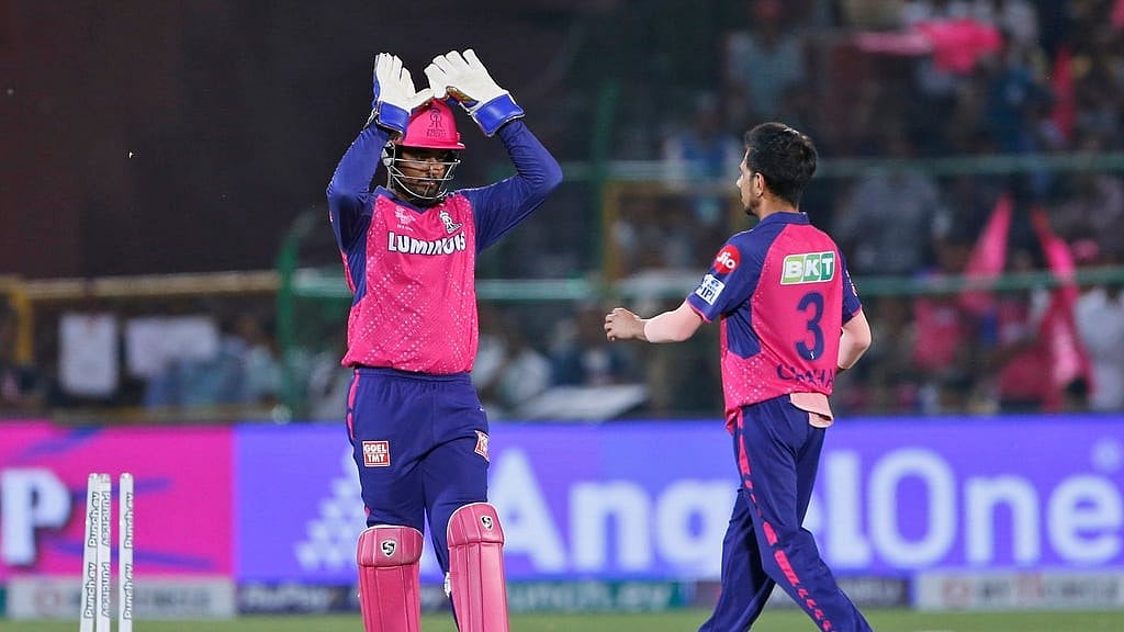 Rajasthan Royals' captain Sanju Samson, left, congratulates teammate Yuzvendra Chahal for taking the wicket of Gujarat Titans' captain Shubman Gill during the Indian Premier League 2024 match in Jaipur on Wednesday (April 10). - AP/Surjeet Yadav