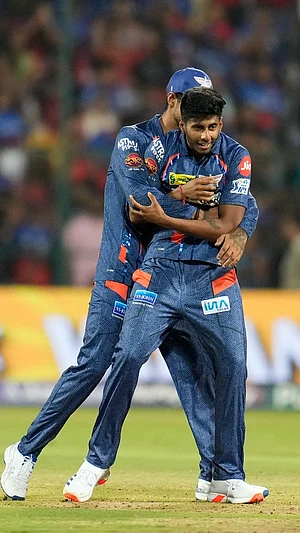 AP : Mayank Yadav celebrates a wicket.