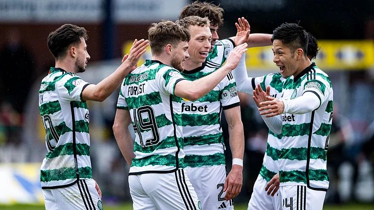 Celtic celebrate at Dens Park - null