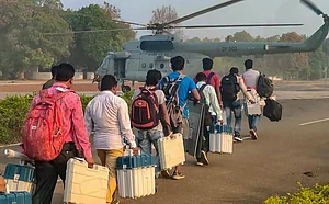 PTI : Polling officials with EVMs and other election material leave for poll duty, ahead of Lok Sabha elections, in Sukma district, Chhattisgarh, Tuesday, April 16
