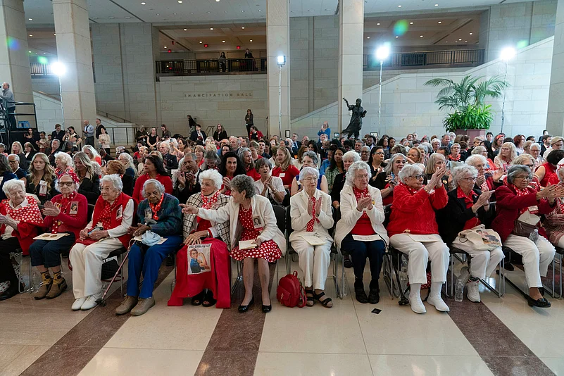 World War II factory workers known as Rosie the Riveters applaud during the Congressional Gold Medal Ceremony in honor of Rosie the Riveter on Capitol Hill in Washington.