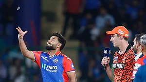 AP : Rishabh Pant and Pat Cummins at the toss