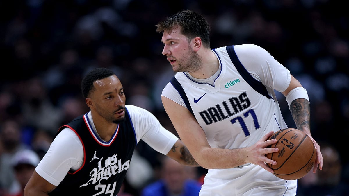 Luka Doncic #77 of the Dallas Mavericks is defended by Norman Powell #24 of the LA Clippers during the first half at Crypto.com Arena on April 23, 2024.