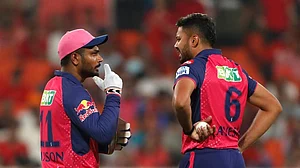 AP/Surjeet Yadav : Rajasthan Royals' captain Sanju Samson, left, speaks to Avesh Khan during the Indian Premier League cricket match between Punjab Kings and Rajasthan Royals in Mohali, India, Saturday, April 13, 2024.