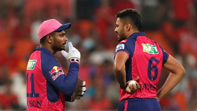 Rajasthan Royals' captain Sanju Samson, left, speaks to Avesh Khan during the Indian Premier League cricket match between Punjab Kings and Rajasthan Royals in Mohali, India, Saturday, April 13, 2024. - AP/Surjeet Yadav