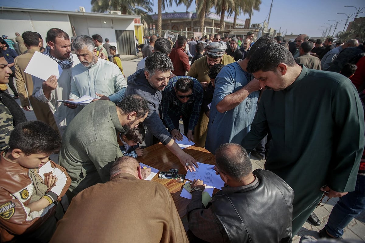 AP : Supporters of the Shiite cleric Muqtada al-Sadr sign a pledge to stand against homosexuality in Kufa, Iraq, Dec. 2, 2022|  