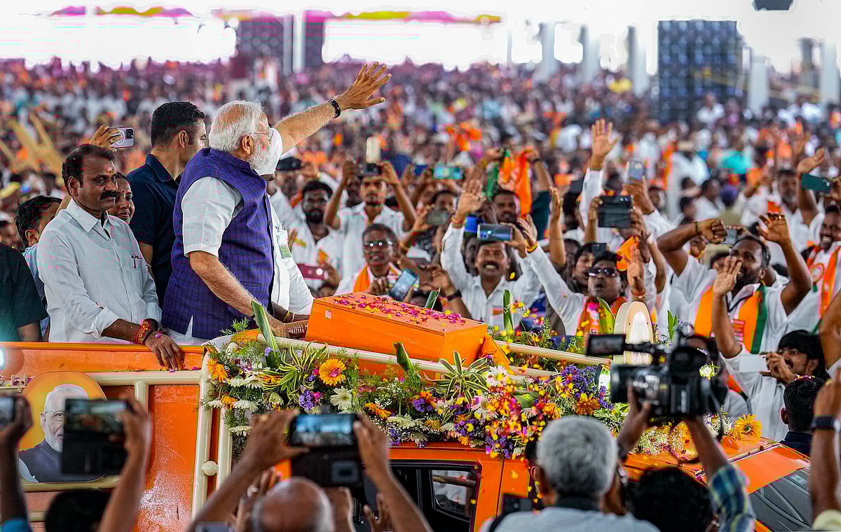 PTI Photo/R Senthil Kumar : Prime Minister Narendra Modi waves at supporters as he arrives for a public meeting ahead of Lok Sabha elections, in Salem, Tamil Nadu, Tuesday, March 19, 2024