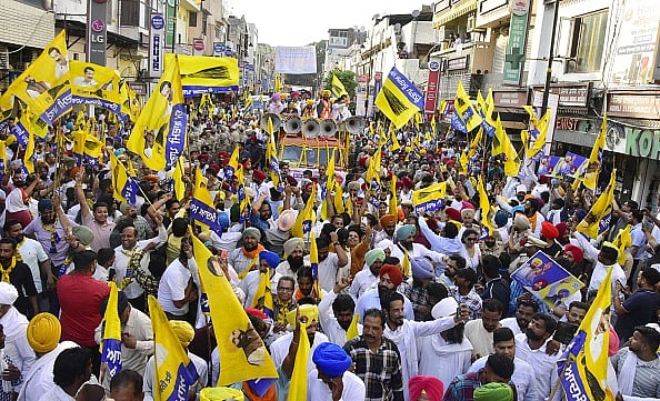  Punjab Chief Minister Bhagwant Mann, Aam Aadmi Party (AAP) candidate from Amritsar Constituency Kuldeep Singh Dhaliwal with party leaders during a road show ahead of the Lok Sabha election at Hall bazaar on April 25, 2024 in Amritsar, India.  - (Photo by Sameer Sehgal via Getty Images)