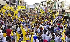 (Photo by Sameer Sehgal via Getty Images) : Punjab Chief Minister Bhagwant Mann, Aam Aadmi Party (AAP) candidate from Amritsar Constituency Kuldeep Singh Dhaliwal with party leaders during a road show ahead of the Lok Sabha election at Hall bazaar on April 25, 2024 in Amritsar, India.