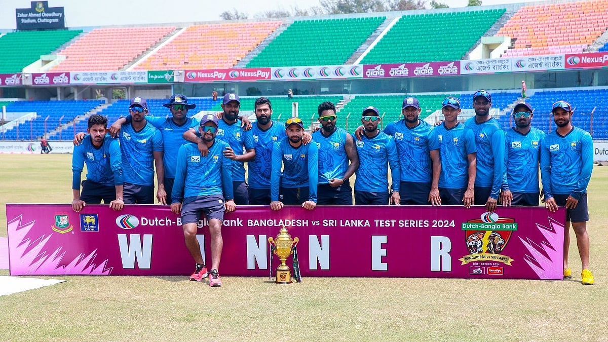 Photo: X/ @OfficialSLC : Sri Lanka National Cricket Team posing with the trophy after defeating Bangladesh by 192 runs in the second Test match at Chattogram.