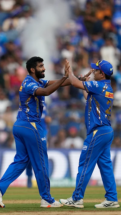 AP%20Photo%20%3A%20Jasprit%20Bumrah%20celebrates%20the%20wicket%20of%20DC%20batter%20with%20Piyush%20Chawla.