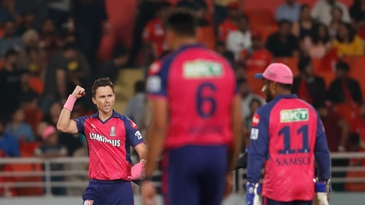 AP Photo/Surjeet Yadav : Rajasthan Royals' Trent Boult, left, celebrates the dismissal of Punjab Kings' Ashutosh Sharma during the Indian Premier League cricket match between Punjab Kings and Rajasthan Royals in Mohali.