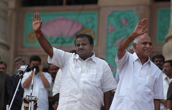 Getty Images : HD Kumaraswamy, son of former prime minister HD Devegowda and Janata Dal (Secular) with BS Yediyurappa, BJP Leader Karnataka Assembly