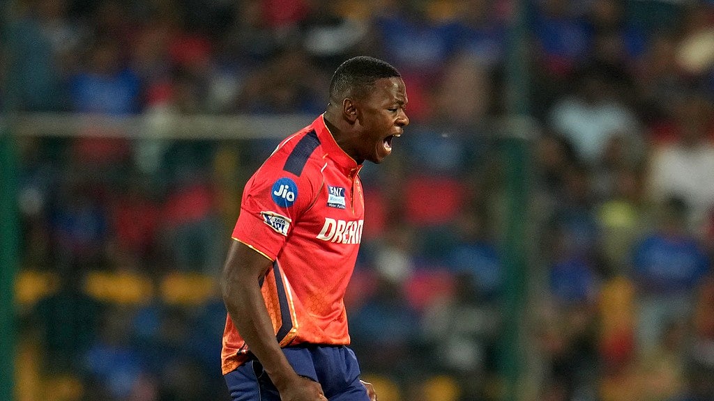 Punjab Kings' Kagiso Rabada celebrates the dismissal of Royal Challengers Bengaluru's captain Faf du Plessis during the Indian Premier League cricket match between Royal Challengers Bengaluru and Punjab Kings in Bengaluru, India, Monday, March 25, 2024.  - (AP Photo/Aijaz Rahi)


