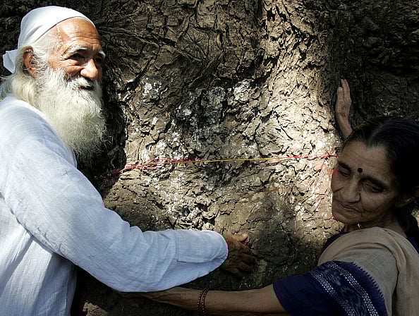 Getty Images : Environmentalist Sunderlal Bahuguna of the Chipko movement fame and his wife Vimla, participates in a Chipko rally to save the trees on LBC road