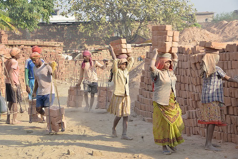 | Photo: PTI : Labour Day eve