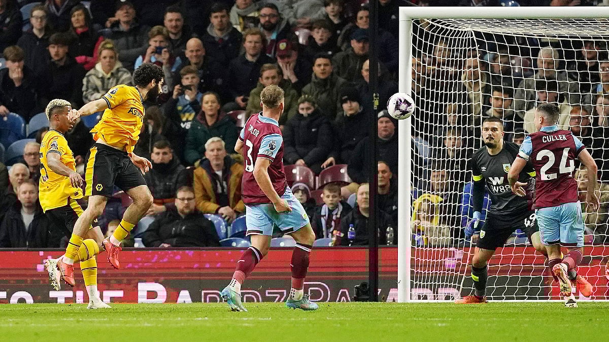 Photo: Martin Rickett/PA : Rayan Ait-Nouri, second left scores Wolves’ equaliser against Burnley.