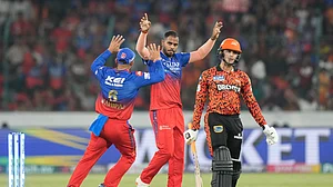 AP Photo/Mahesh Kumar A. : Royal Challengers Bengaluru's Yash Dayal, celebrates the dismissal of Sunrisers Hyderabad's Abhishek Sharma, right, during the Indian Premier League cricket match between Royal Challengers Bengaluru and Sunrisers Hyderabad in Hyderabad.