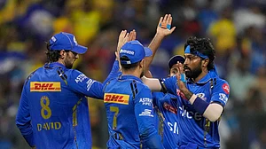 AP Photo/ Rafiq Maqbool : Mumbai Indians' captain Hardik Pandya, right, celebrates the wicket of Chennai Super Kings' captain Ruturaj Gaikwad during the Indian Premier League cricket match between Mumbai Indians and Chennai Super Kings in Mumbai.