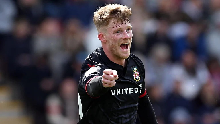 Andy Cannon celebrates scoring Wrexham’s third goal. - Barrington Coombs/PA