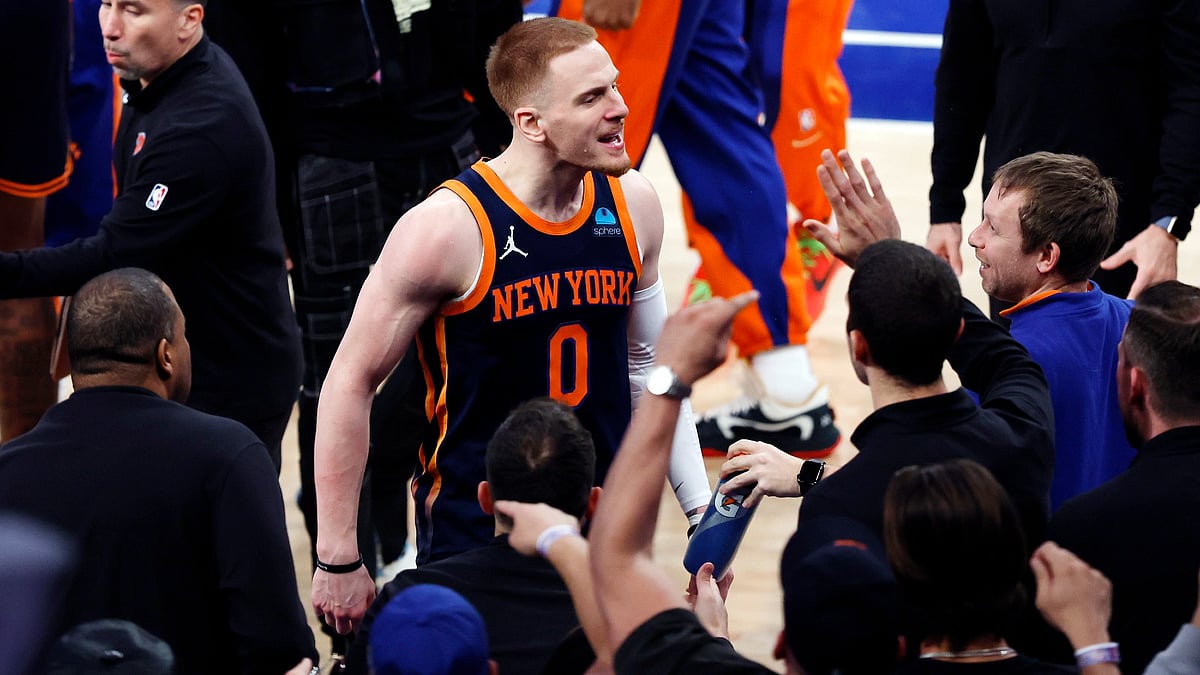 New York Knicks guard Donte DiVincenzo celebrates a win over the Philadelphia 76ers on April 22, 2024. - null